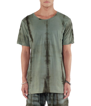 Men wearing a blue green T shirt made from organic cotton and hand dyed with plants.