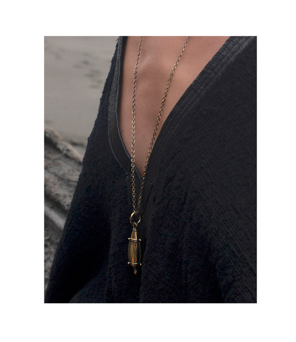 Gorgeous brass bottle pendant on matching chain.  Twists open to reveal a spike perfect for dabbing on your favorite perfume. A necklace of my design, the tear drop bottle has been hand cast. 