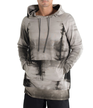 Drawstring hoodie sweatshirt crafted from medium weight cotton terry finished with ecovero* ribbing, lined hood. Hand dyed with plants using the shibori method.