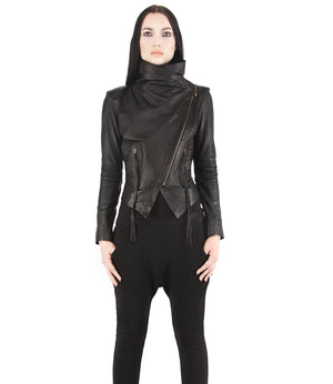 This image features the "nightingale jacket," a stylish andavant-garde black leather jacket designed by Jan Hilmer. The jacket is modeled by a woman, showcasing its fitted silhouette and asymmetrical zipper details.