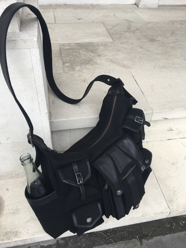 Shoulder bag, with leather strap & multiple pockets.